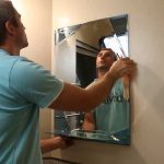 We hang a mirror in the bathroom photo