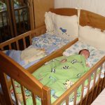 cot for twins made of natural wood
