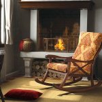oak rocking chair by the fireplace