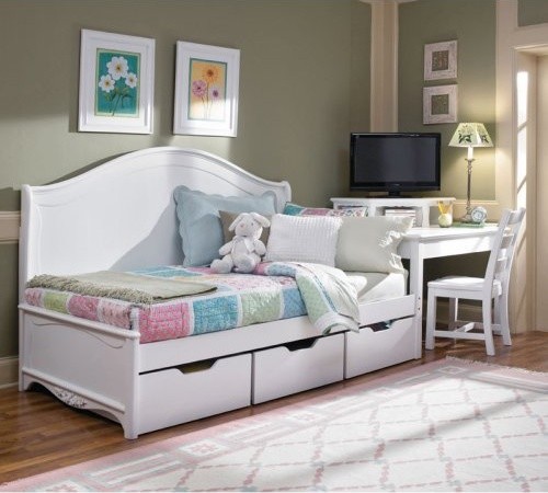 Baby bed with storage boxes in the bright bedroom