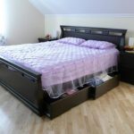 Double wooden bed with drawers
