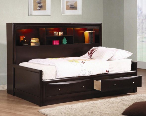 Bed for a teenager with storage boxes in the bedroom