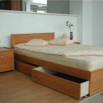 Bed with large drawers for storing bed linen