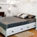 white double bed with drawers
