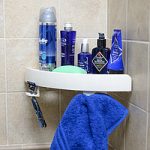 corner shelf in the bathroom with suction cups
