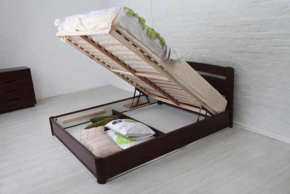 Bed with a lifting mechanism photo