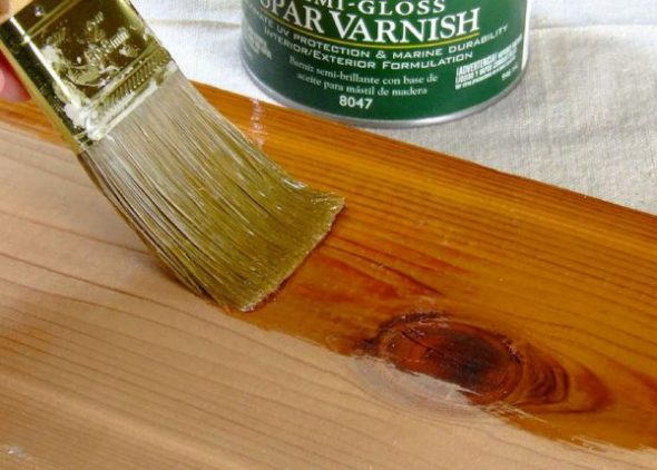 Varnishing the floor with a brush