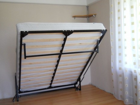 Lifting bed against the wall