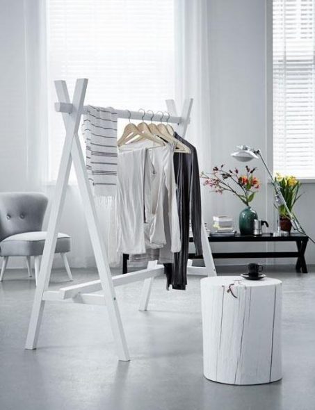 Stylish coat rack with white painted bars