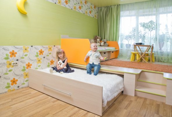 Children's bed-podium with a place to play