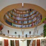 Bookshelf in the ceiling in the form of a porthole