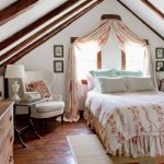 Bed with canopy headboard to the window in the attic