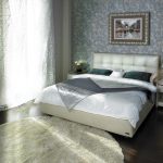 Bed with soft ivory headboard