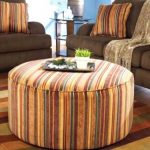 Striped ottoman with cushions to match the interior