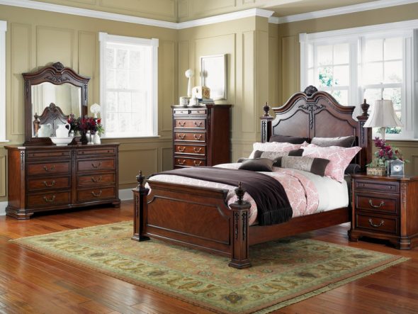 Stylish bedroom in a classic style with a wooden bed by the window
