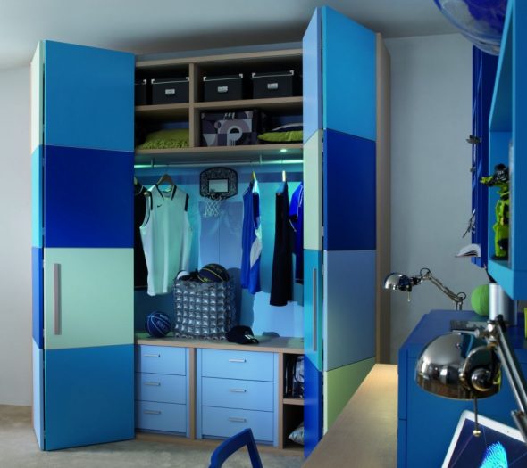 Convenient and functional wardrobe in the room for the boy