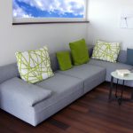 Green sofa cushions as bright accents