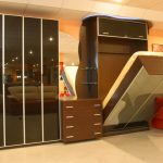 Mirrored wardrobe-transformer na may built-in na kama