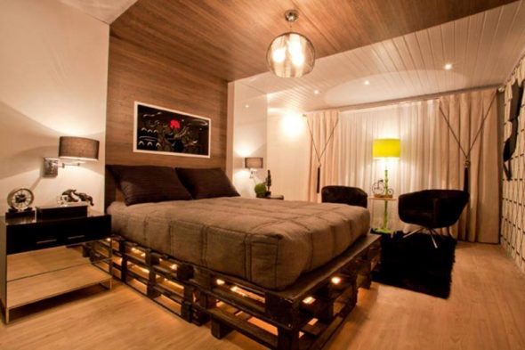 Bed of wooden pallets in the interior
