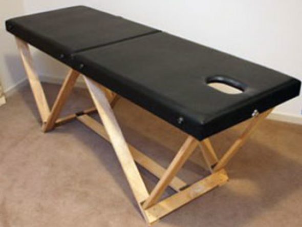 Black folding massage table