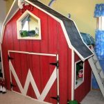 Children's loft bed in the shape of a house with a play space at the bottom