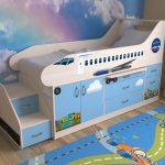 Baby bed with sides in the form of a plane