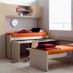 Bunk transforming bed with table