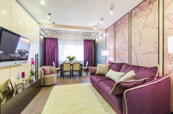 Purple murals and a sofa in the interior
