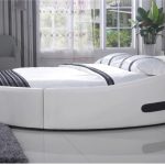 Beautiful bed with an unusual shape in the bedroom