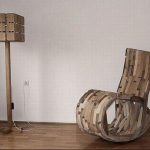 Rocking chair at cardboard floor lamp