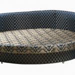 Round sofa bed with upholstery ornaments