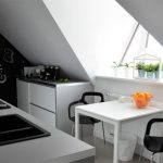 Kitchen on the attic floor with unusual furniture