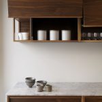 Kitchen furniture made of walnut combined with white