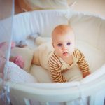 Baby in a round bed