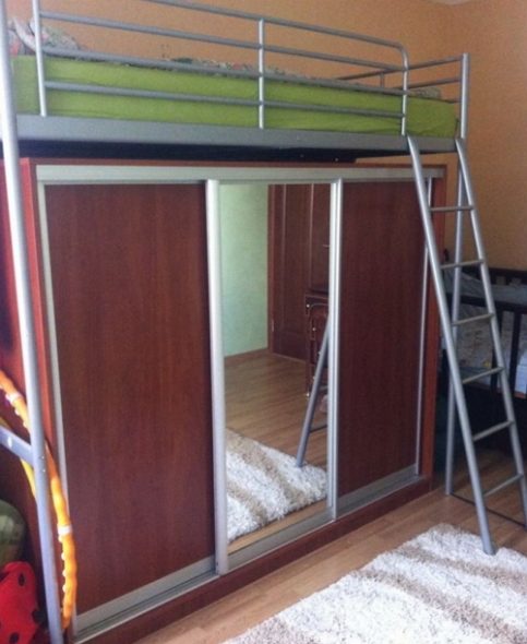 Metal bed above the wardrobe