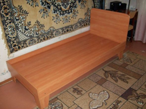 Single bed with attached headboard
