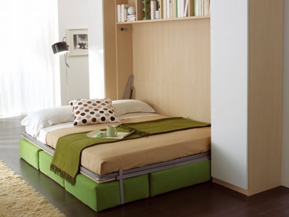 Folding wardrobe bed with a metal frame