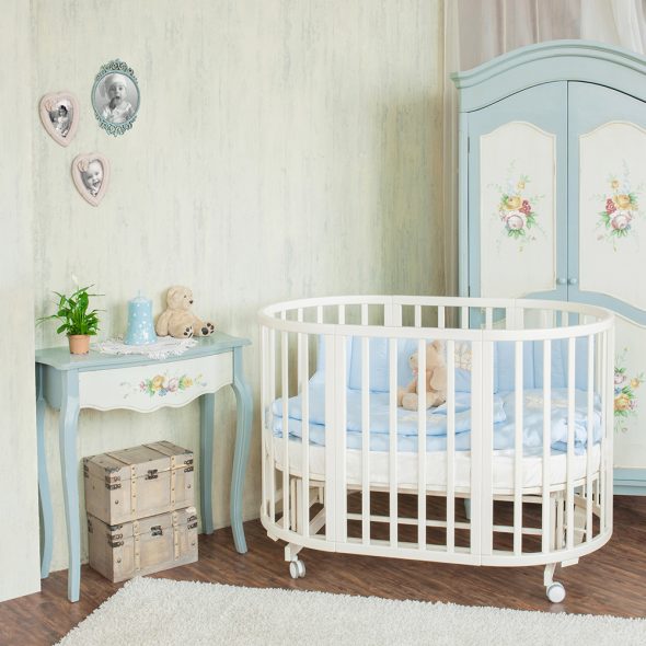 Oval bed for the baby in the nursery