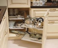 Placing the dishes in the corner cabinet