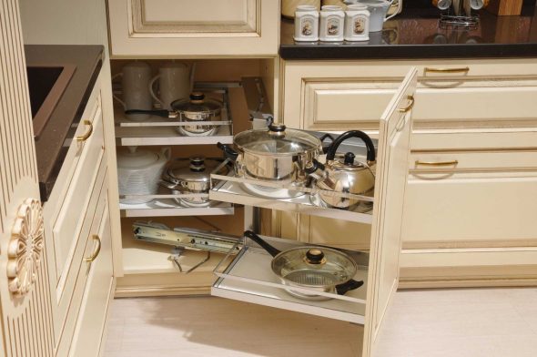 Placing the dishes in the corner cabinet