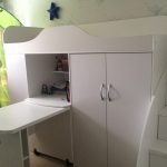 Wardrobe with built-in table and bed upstairs