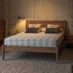 Loft style bedroom with walnut furniture