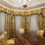 Bright baroque dining room with gilded stucco and artistic parquet