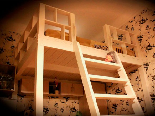 Built-in loft bed fixed to the wall and to the floor