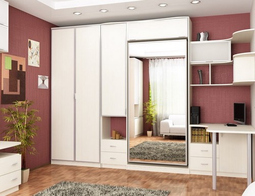 Built-in bed in the closet with mirrored facades