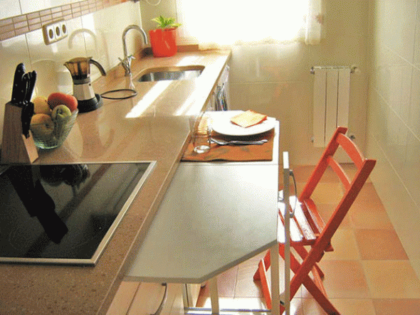 Retractable kitchen table for a small kitchen