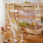 High wooden bed with a play area