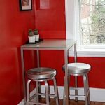 High metal table with chairs