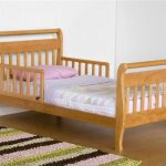 Wooden bed with curved bylets