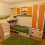 Bunk bed with a built-in wardrobe and shelves - a good solution for school-age children